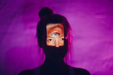 Blind woman with third eye on her forehead in dark
