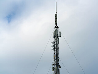 Obraz premium Cellular communications tower providing mobile phone coverage and 4G as well as 5G.