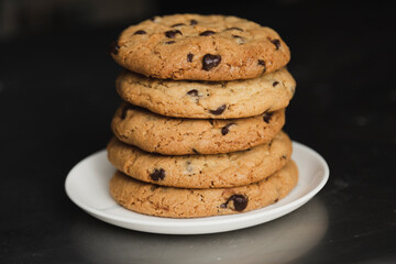 Delicious stacked chocolate chip cookies - tower of homemade cookies fresh from the oven