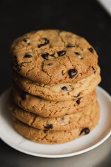 Delicious stacked chocolate chip cookies - tower of homemade cookies fresh from the oven