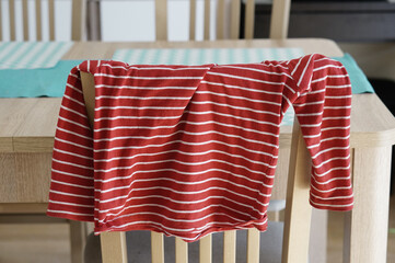 Closeup shot of a blouse on a chair