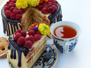 Slice cake with fresh raspberries. Composition on a white background.