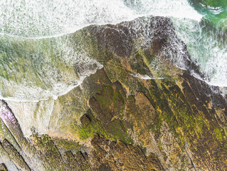 Aerial drone view on Fanore beach, county Clare, Ireland. Top down view, Stone rock coast line and ocean waves.