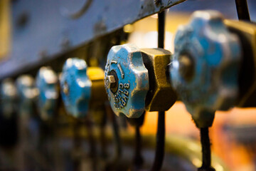 Close-up of old blue valves. Vintage equipment.  Electric power station.