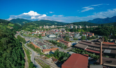 Aerial panorama of the city of Ravne na Koroskem, Slovenia. Visible part of industrial elements mixing with modern city in the background.