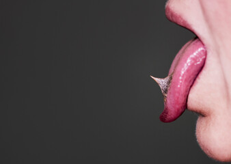 Tongue out, spikes on a tongue, close up