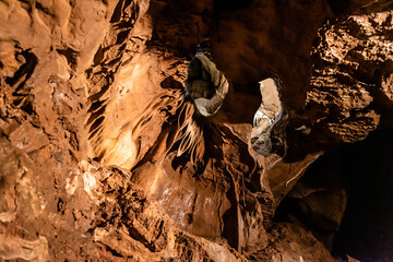 Illuminated picturesque karst rock formations in Balcarka Cave, Moravian Karst, Czech: Moravsky...