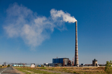 Ekibastuz, Kazakhstan. The highest electric power plant chimney in the world. White steam...