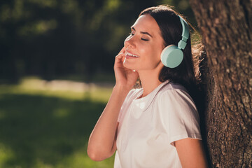 Close-up profile side view portrait of her she nice attractive lovely pretty cute dreamy cheerful cheery girl enjoying spending free time serene rest relax autumn fall September listening hit melody