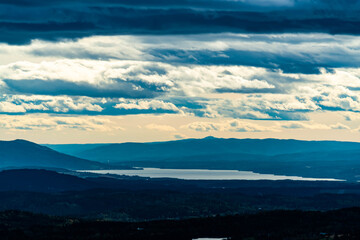 Morning view over Norwegian mountains with a large fjord in the distance.