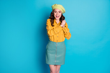 Portrait of positive cheerful girl impressed wait want hope gift present feel grateful scream wow omg wear look good clothes isolated over blue color background