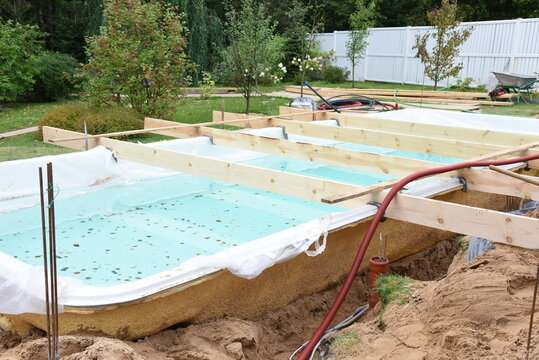 Fiberglass Swimming Pool Construction Building. Garden Or Backyard Landscape Works For Swimming Pool Installation.