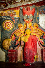 Ancient colorful statue of the Buddha in Ravana Temple near Ella town on the island of Sri Lanka