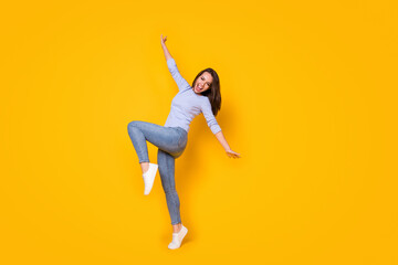 Fototapeta na wymiar Full length body size view of her she attractive cheerful cheery girl jumping having fun chill out rest relax party time active life dance isolated bright vivid shine vibrant yellow color background