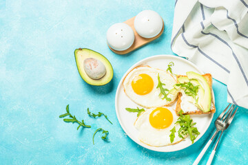 Healthy breakfast with egg, toast and salad.