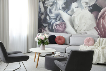 Modern living room interior with comfortable sofa and armchairs