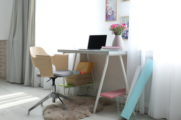 Comfortable workplace with office chair and modern table