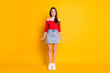 Full length body size view of her she nice attractive lovely pretty cute slender cheerful brown-haired girl posing isolated over bright vivid shine vibrant yellow color background