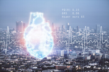 Double exposure of heart icon and cityscape background.