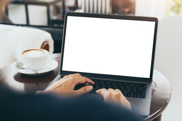 computer mockup blank screen.hand woman work using laptop with white background for advertising,contact business search information on desk at coffee shop.marketing and creative design