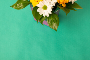 Bouquet of fresh flowers on a green background. Banner, poster, copy space.