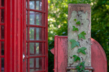 Ivy Postbox with Telephone Box Backdrop in English Countryside