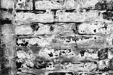 Obraz premium Texture of a brick wall with cracks and scratches which can be used as a background
