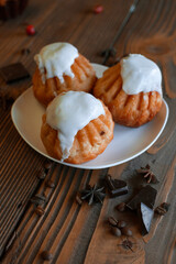 Three vanilla muffins with autumn decoration 