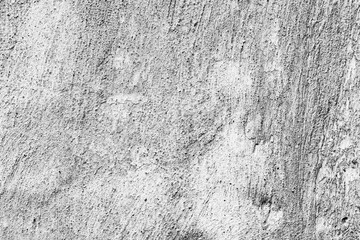 Texture of a concrete wall with cracks and scratches which can be used as a background
