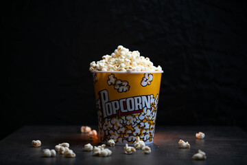 A bucket full of popcorn black background