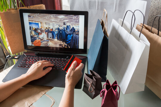 Shopping online, woman's hands makes purchases in the online store online in lockdown coronavirus quarantine, discounts on black friday, cyber monday