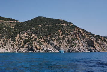 Fototapeta na wymiar yacht anchored in a beautiful bay in the south coast of Sardinia on a sunny day.