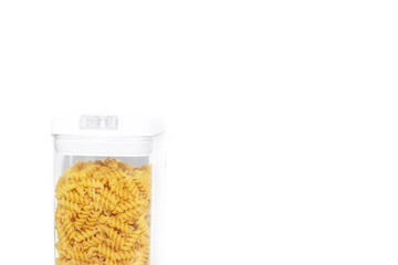 Fusilli macaroni placer . Macaroni in a jar. Article about pasta. Copy space.