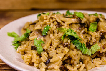 Risotto with mushrooms and paesley in a plate