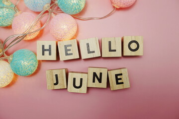 Hello June alphabet letter with space copy on pink background