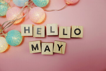 Hello May alphabet letter with space copy on pink background