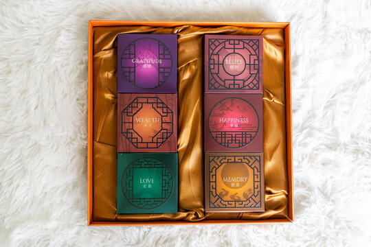 Huzhou, China 15 September 2020: Mid Autumn Festival Mooncakes in gift box. Chinese inscription on boxes: gratitude, love, happiness, belief, wealth, memory