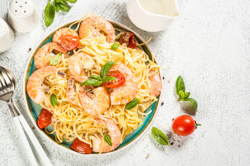 Pasta seafood with shrimp on white table.