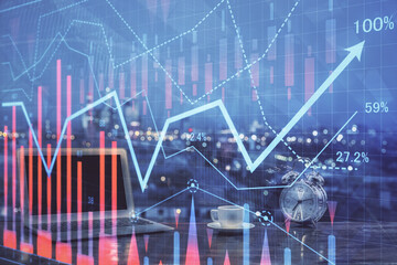 Forex market chart hologram and personal computer background. Multi exposure. Concept of investment.