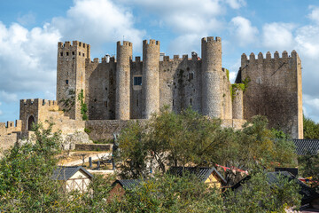 Óbidos castle seen behind a medieval market, Portugal