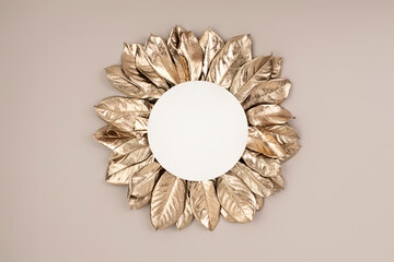 Top view of gold Fall leaves on pastel background with card note. Flat lay. Minimal Autumn concept. Creative copy space.