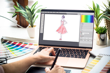 fashion designer working on a laptop