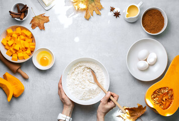 Autumn baking background with pumpkin pie baking ingredients