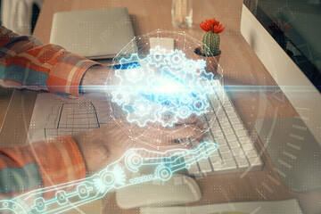 Businessman with computer background with technology theme hologram. Concept of big data. Double exposure.