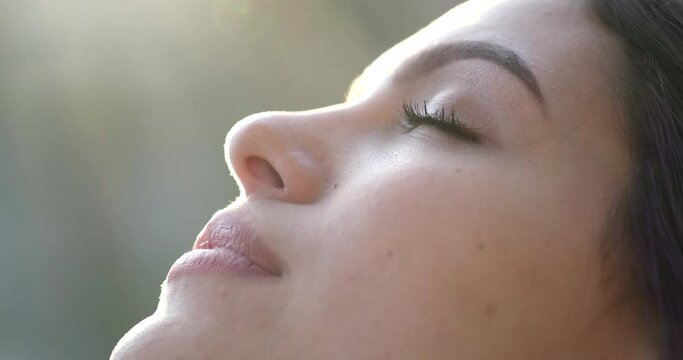 Contemplative young woman with eyes closed in meditation