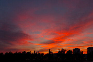 Beautiful sunset over the silhouette of houses in the myth of Podgorica. Montenegro