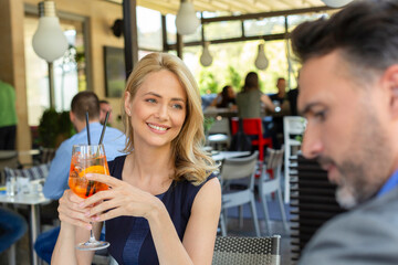 Business couple flirting in the cafe bar