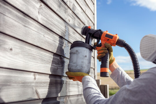 Painting Fence Or Garden Shed With A Paint Sprayer