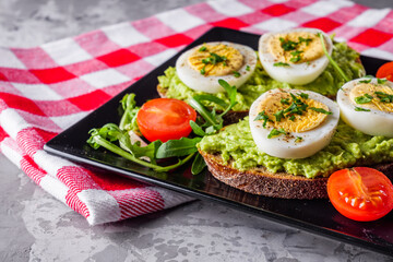 tasty and nutritious avocado sandwich and boiled egg