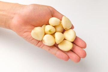 Manicured garlic on white background